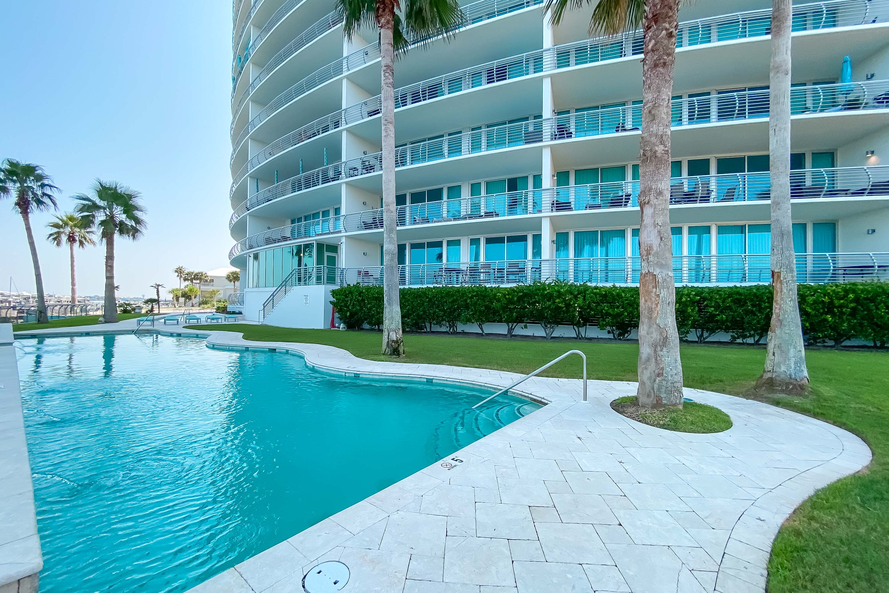 Soak up the sun in style at Bella Luna's magnificent outdoor pool. Framed by the contemporary elegance of the residential tower, this is the epitome of upscale coastal living.