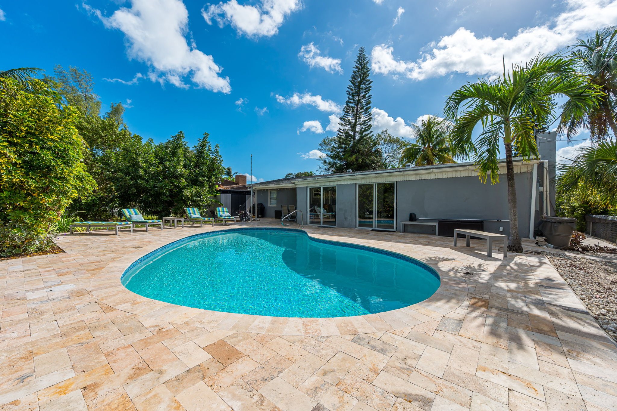 The outside is a highlight, with the heated pool, outdoor sun- loungers, BBQ and covered dining area.