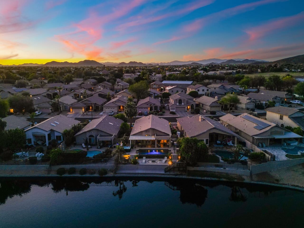 Situated right on the lake with mountain views on the horizon, this home offers the kind of setting that makes guests extend their stays.