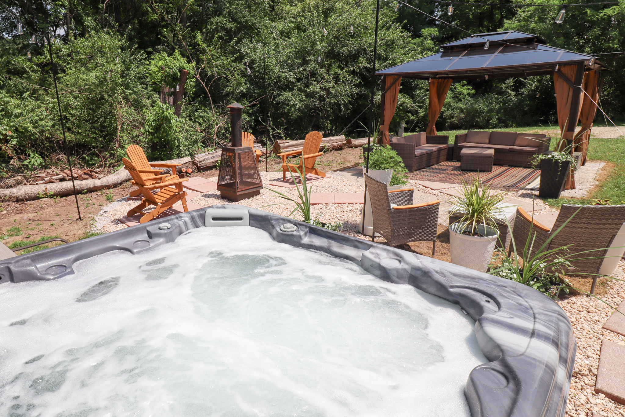 Private backyard oasis is designed for relaxing, gathering, and making memories