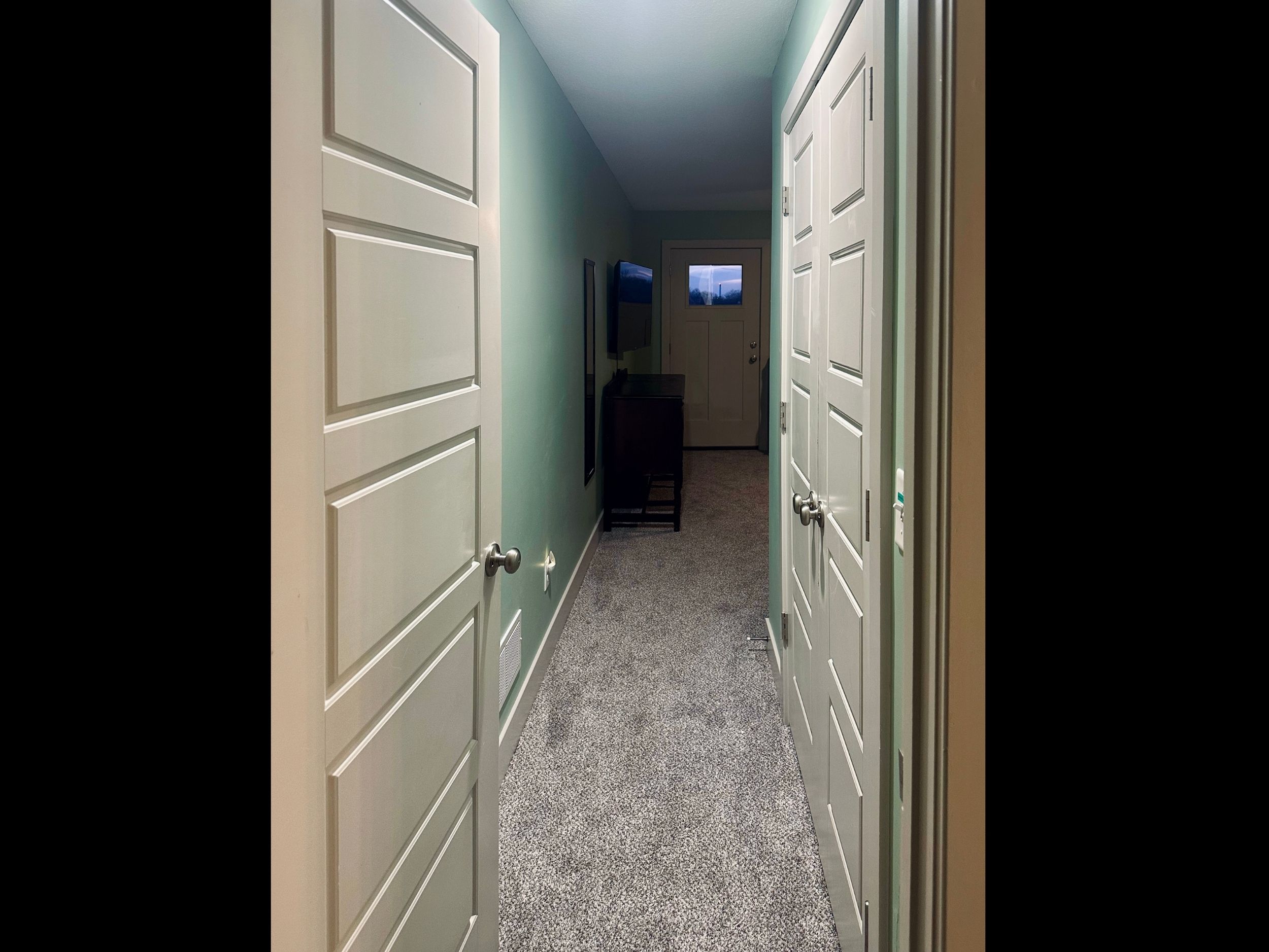 Inviting entry to the primary suite with convenient closet access and a quiet, private retreat feel.