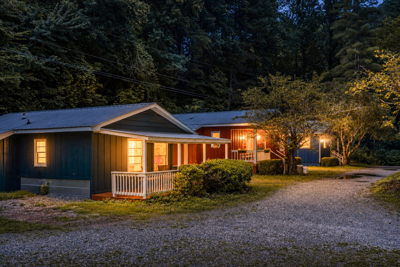 Charming Retreat: Experience mountain nights amidst vibrant, inviting cabin exteriors!
