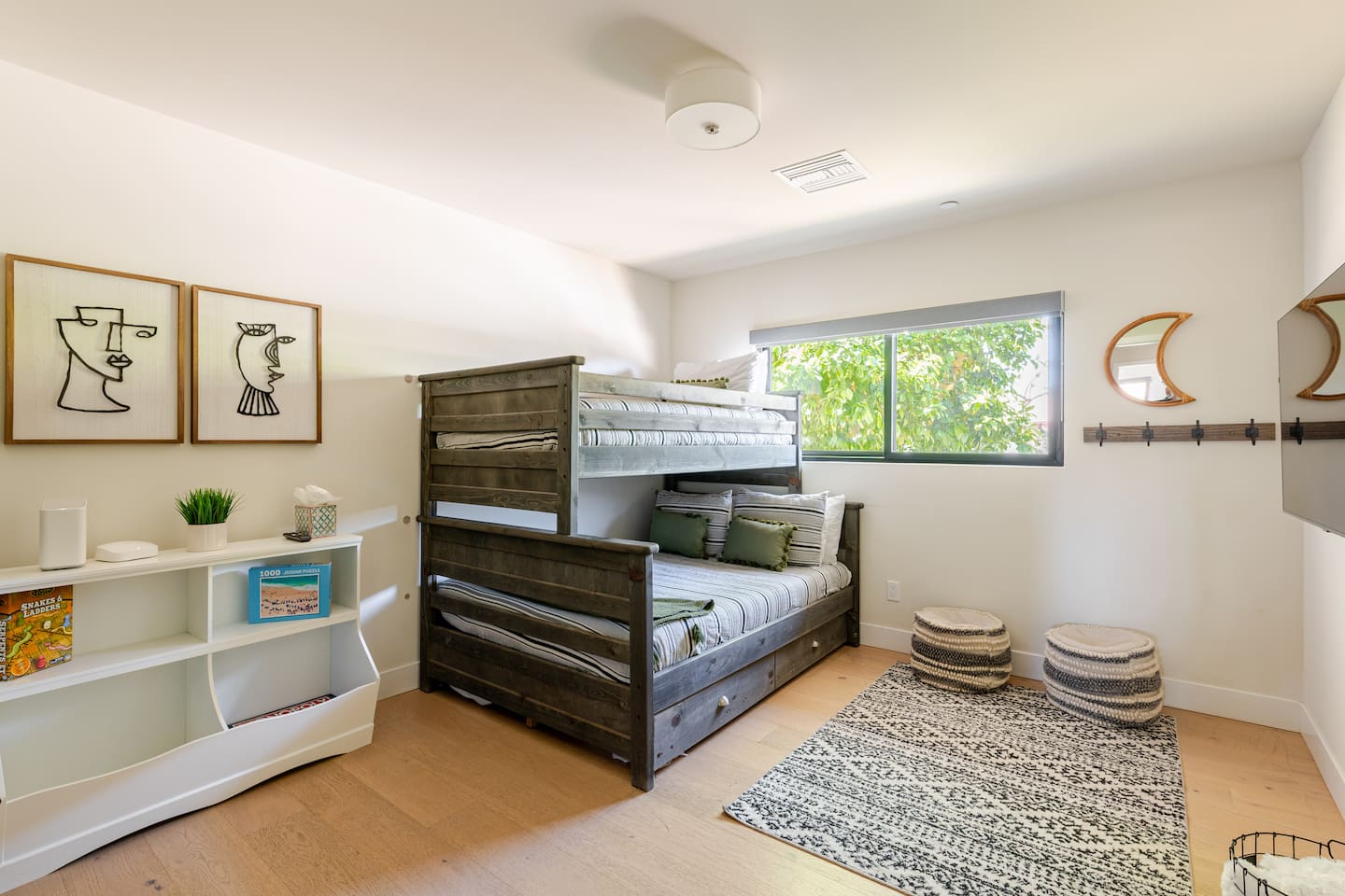 Stylish moon-themed accents and a mini bookshelf add charm and entertainment.