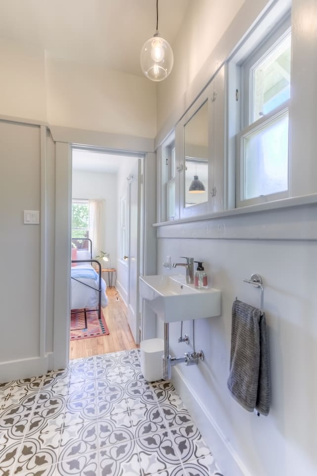 Bathroom, door to each bedroom