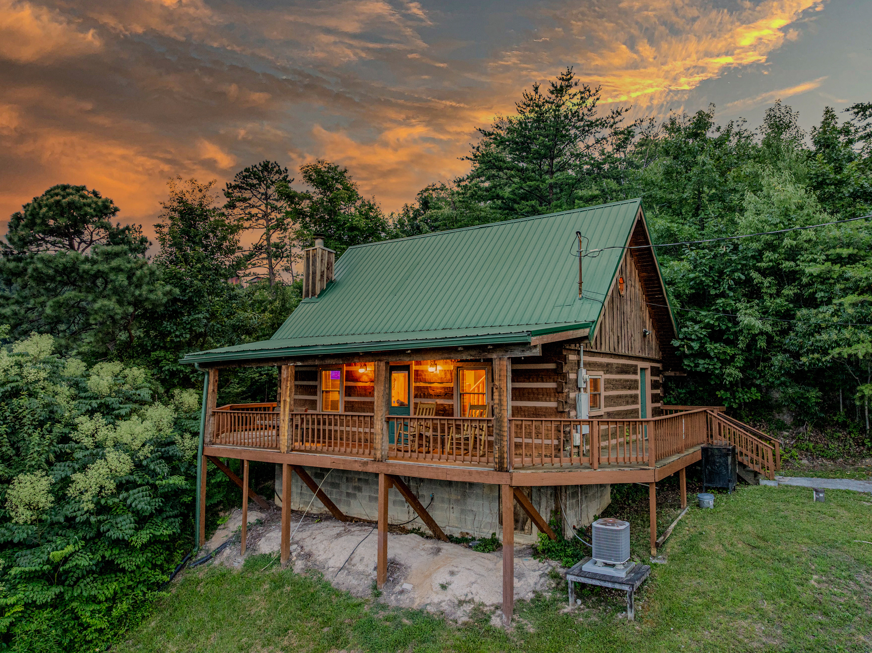 Warm cabin lights welcome you home after a day out
