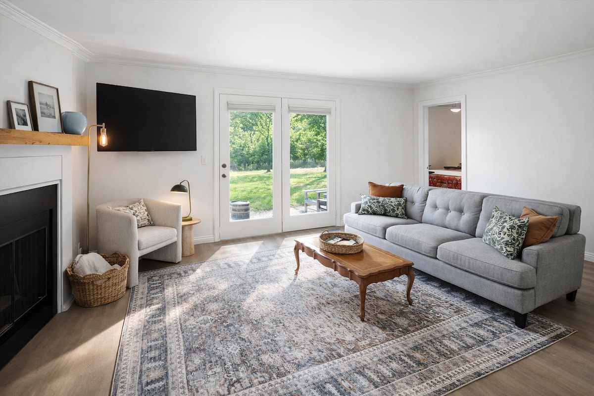 A bright living area with a TV and comfortable seating — great for relaxing after a day out.