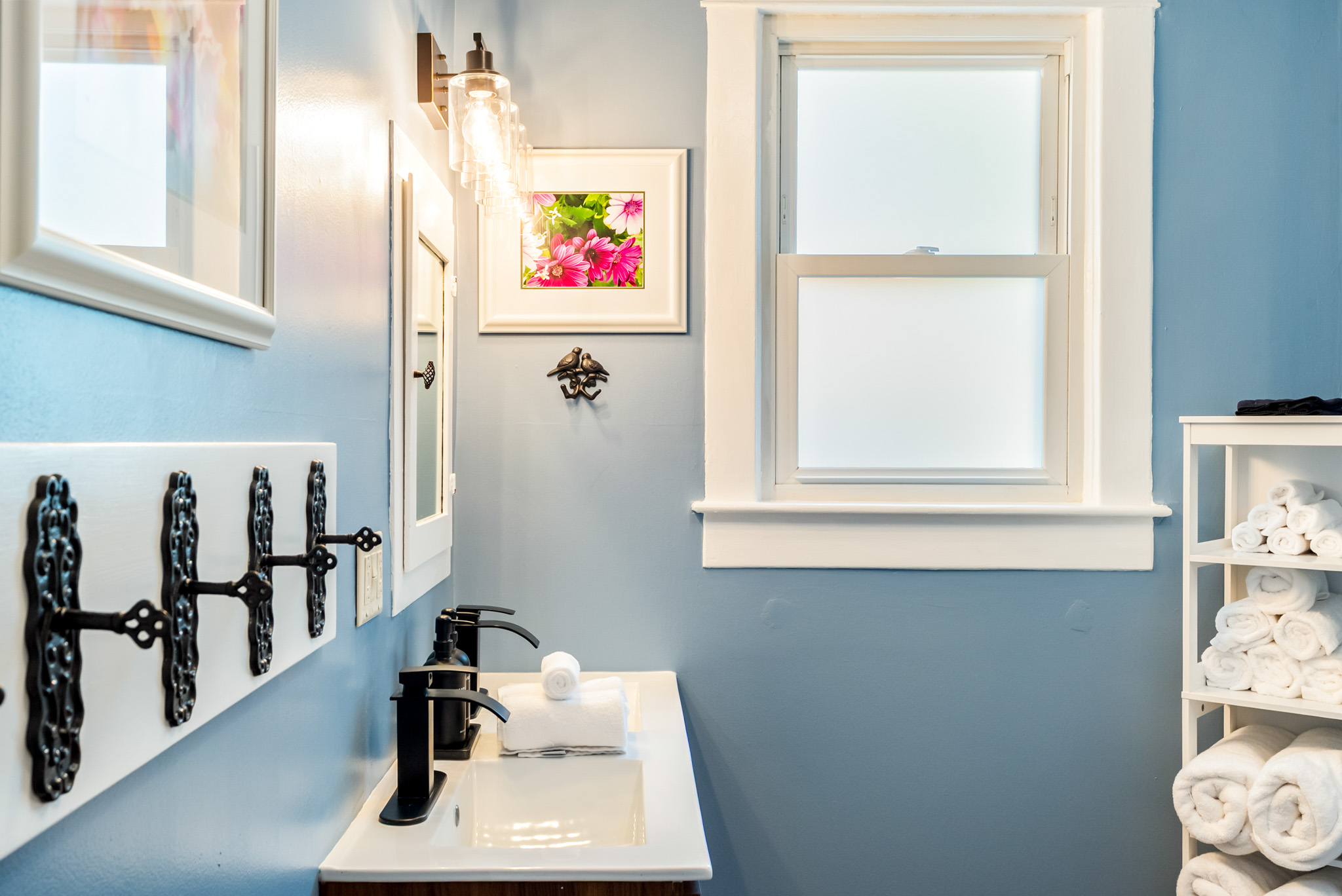 Perfect for larger families. The upper floor's shared full bathroom features a modern double vanity, a walk-in shower and ample space for the kids to get ready for the day.