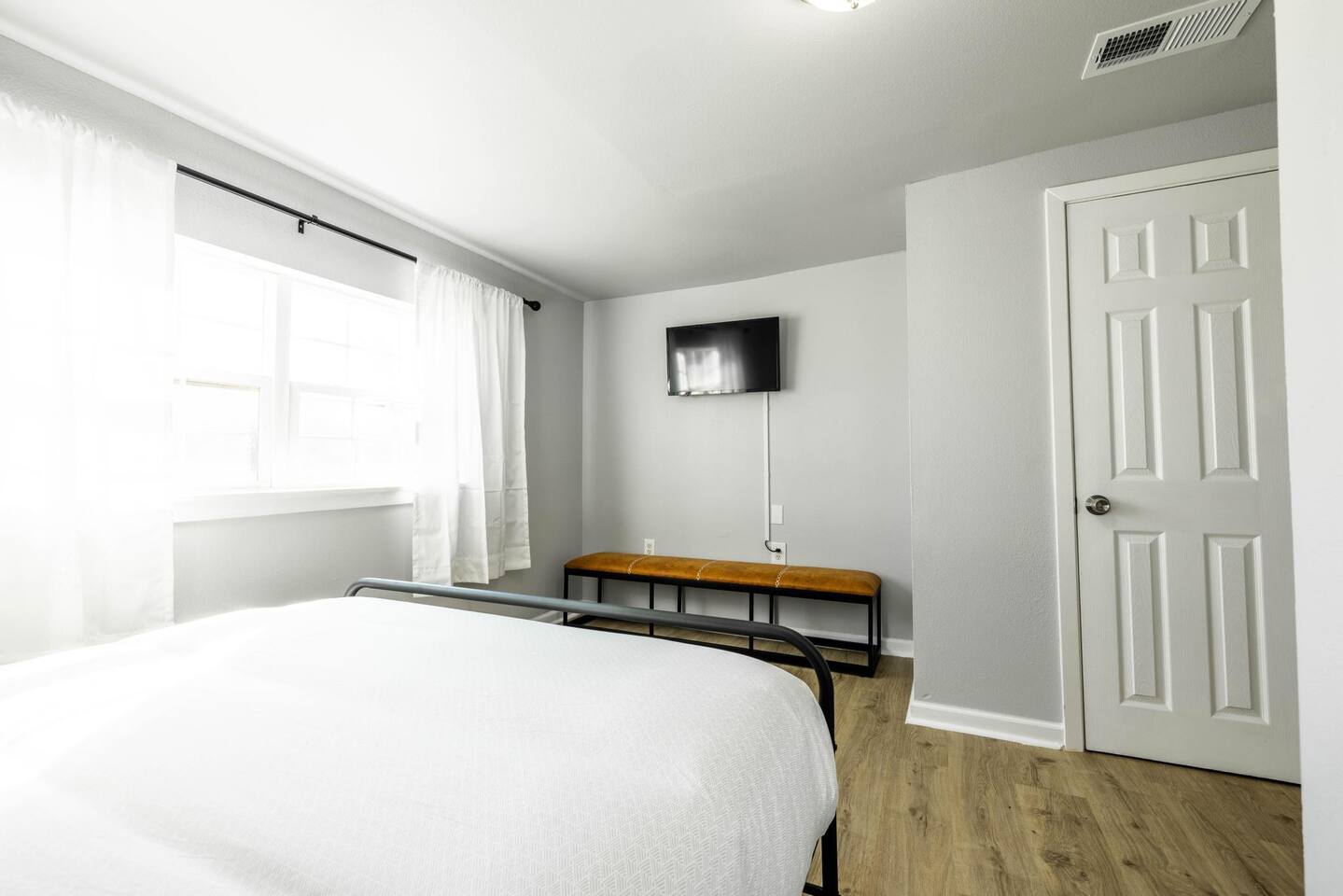 This queen bedroom features a smart TV, perfect for unwinding with your favorite shows before bed.