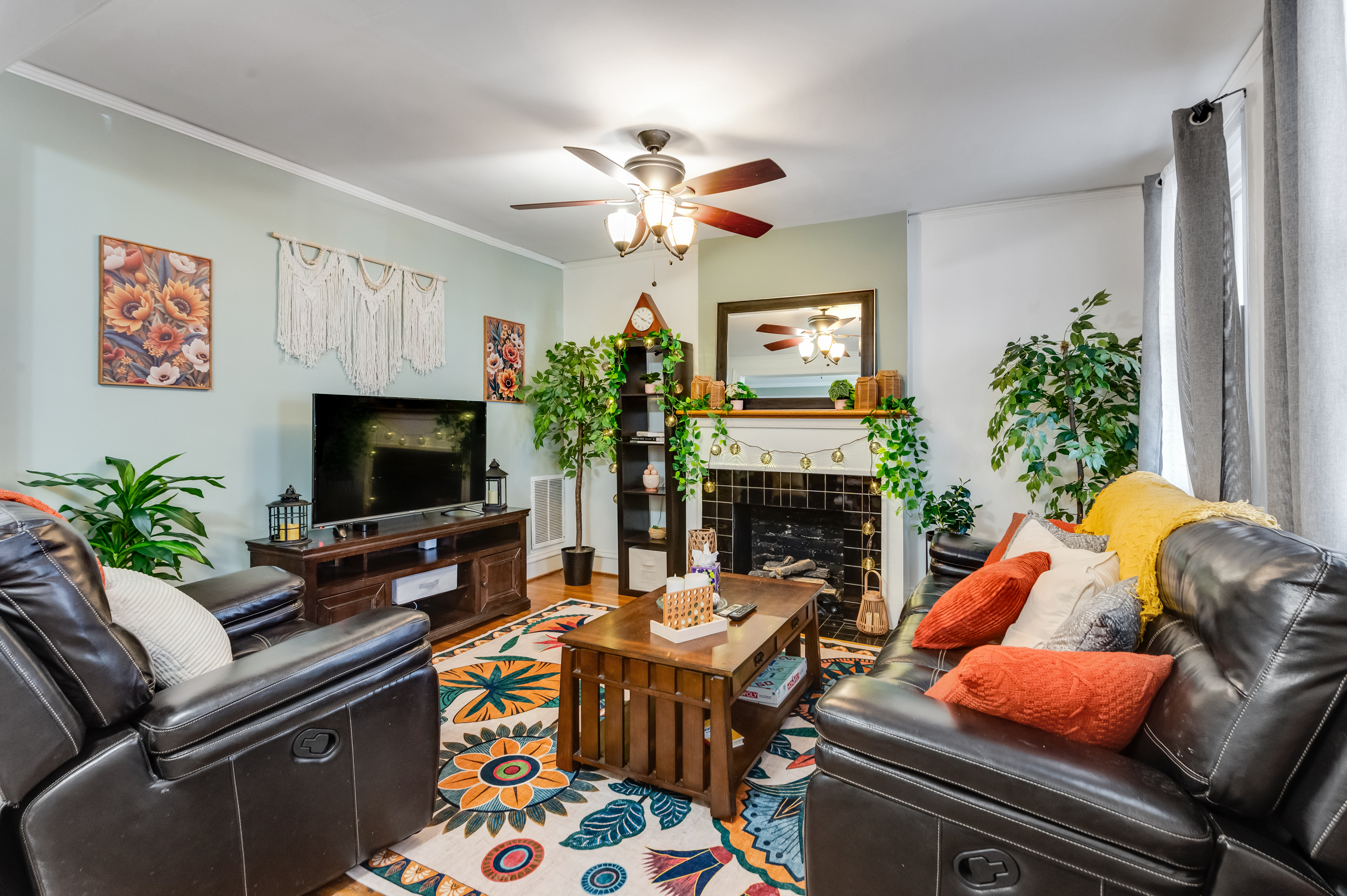 Living Room Oasis: Relax on plush seating surrounded by vibrant decor and warm, welcoming light!