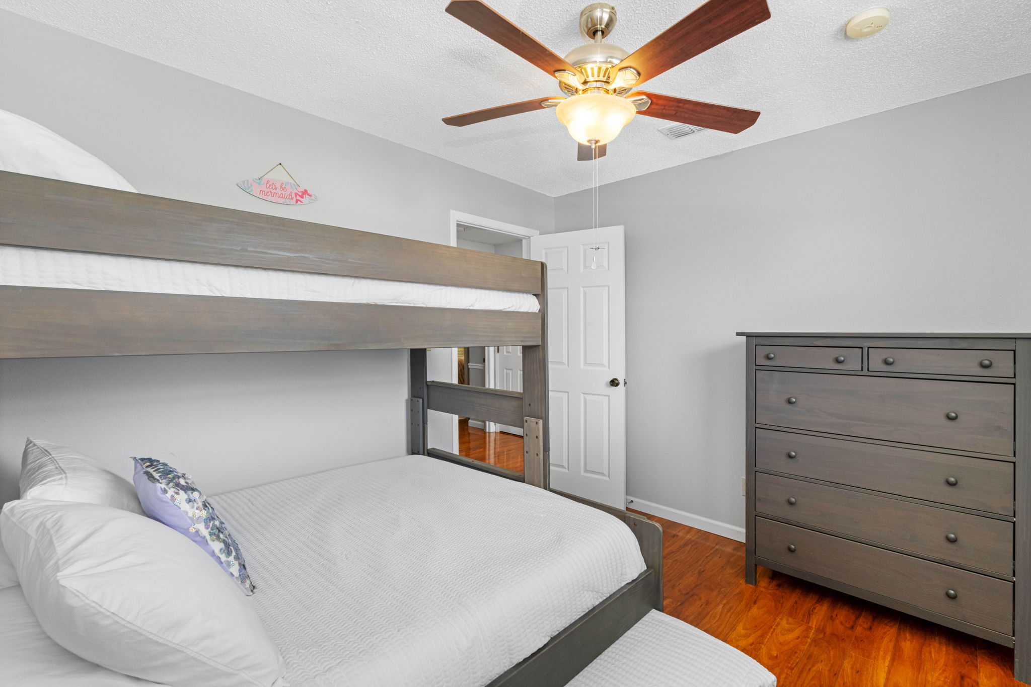 Twin XL over Queen bunk with Twin XL trundle — ideal for a small family or kids sharing a room.