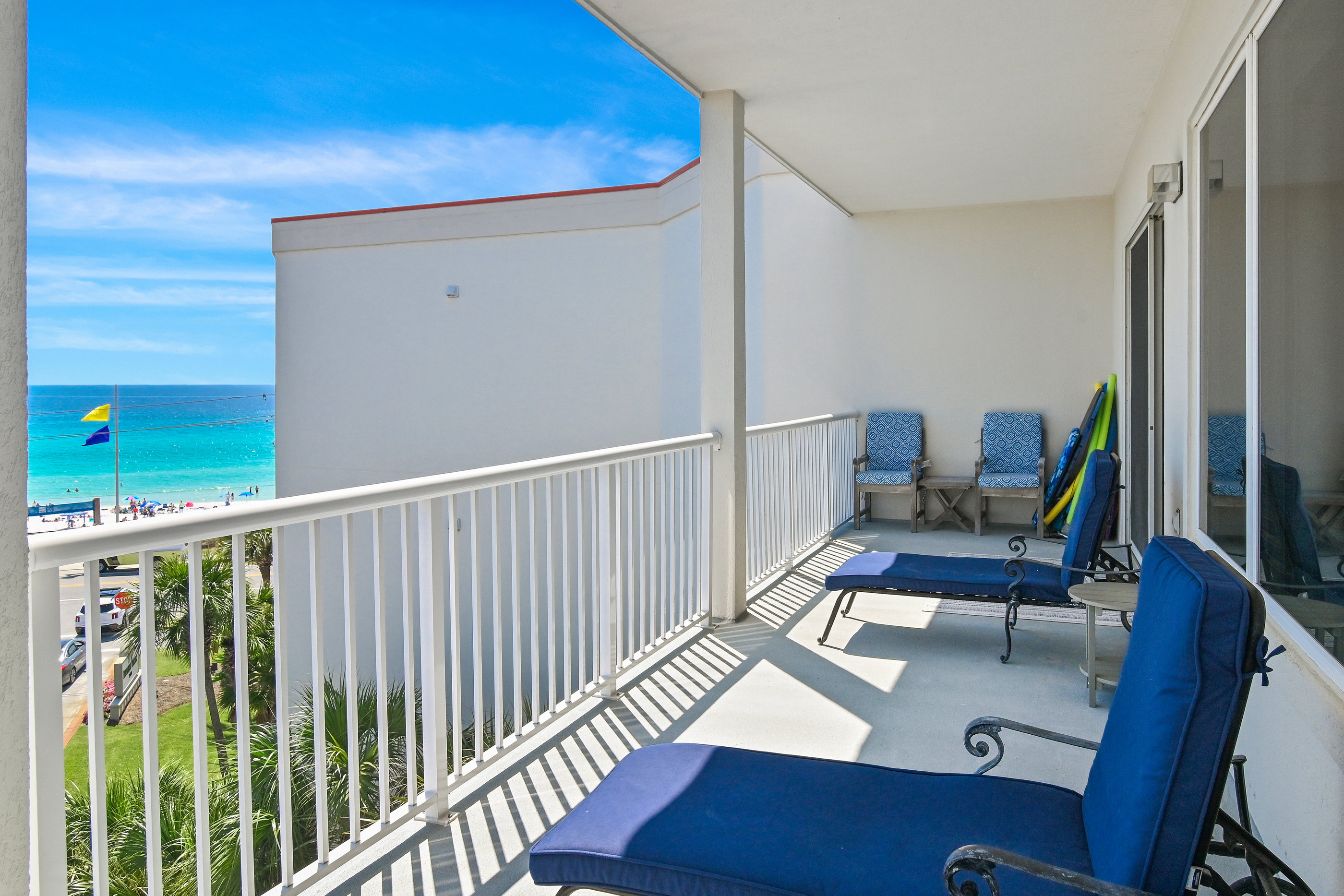 Balcony seating overlooking the sugar‑white sand