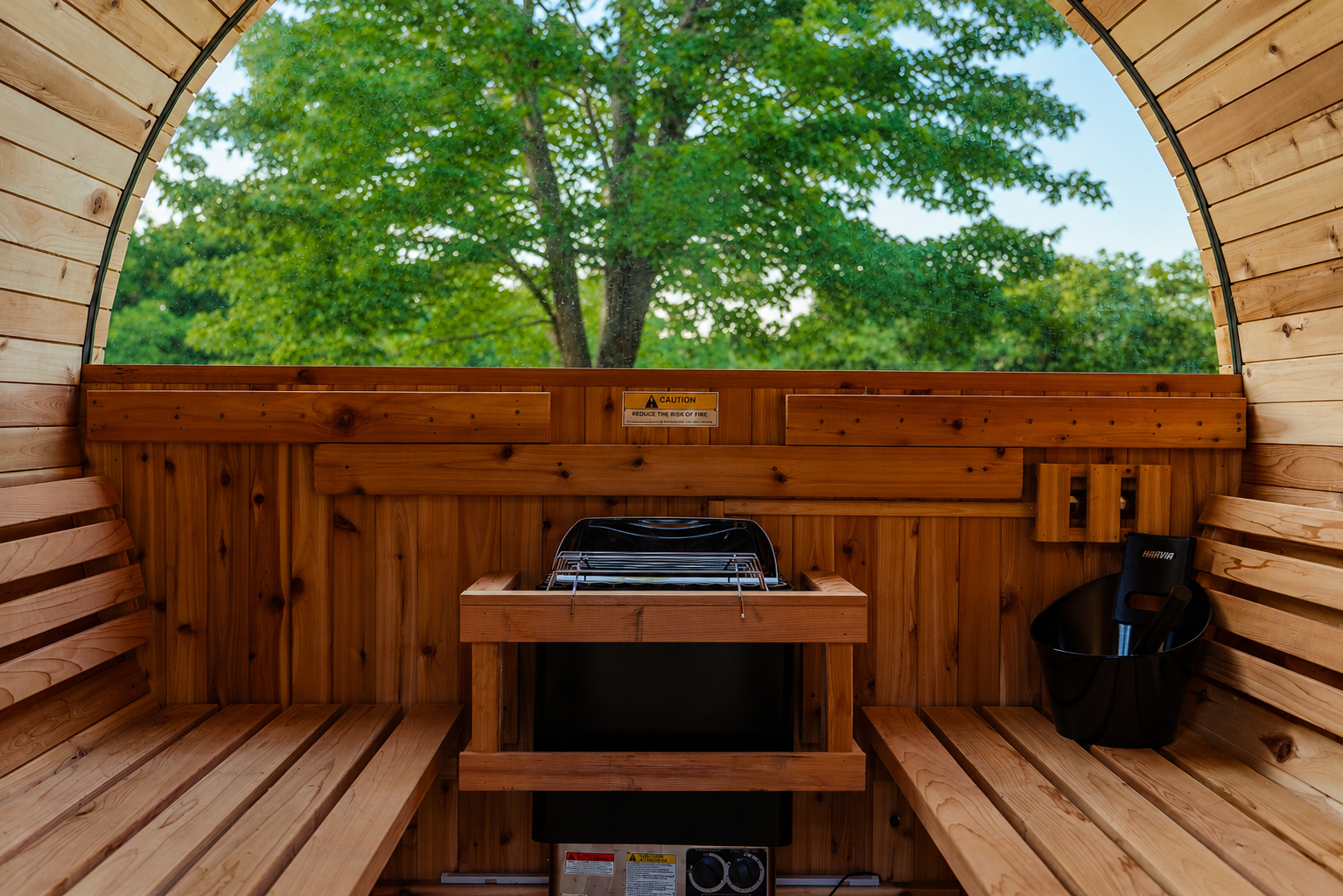 Private barrel sauna with beautiful woodland views for the ultimate relaxation experience.