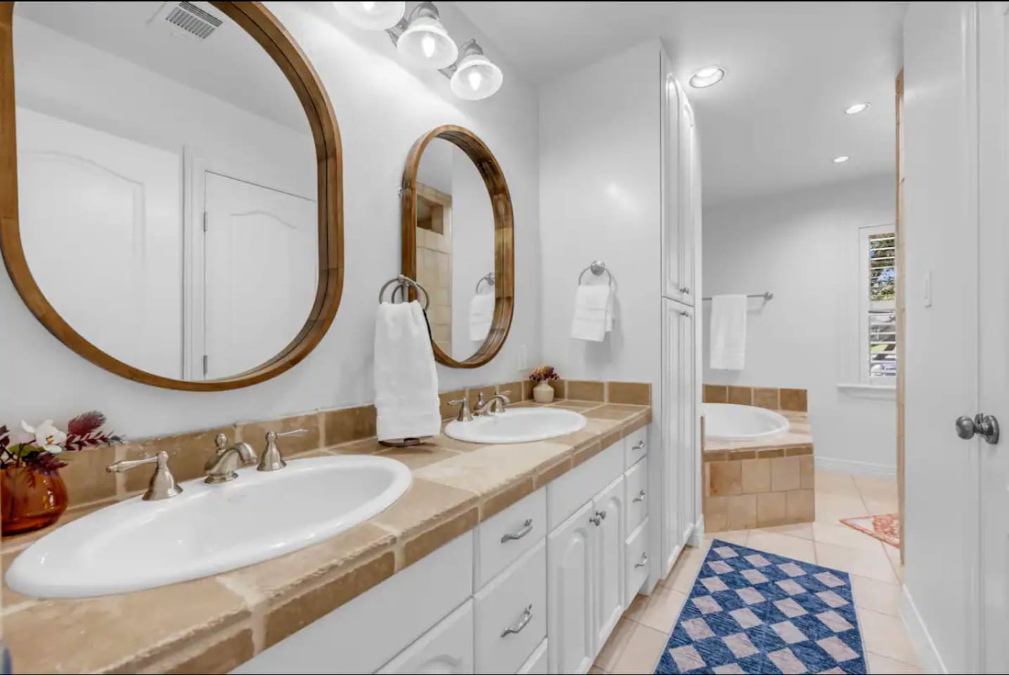 Upstairs primary bathroom with tub and shower