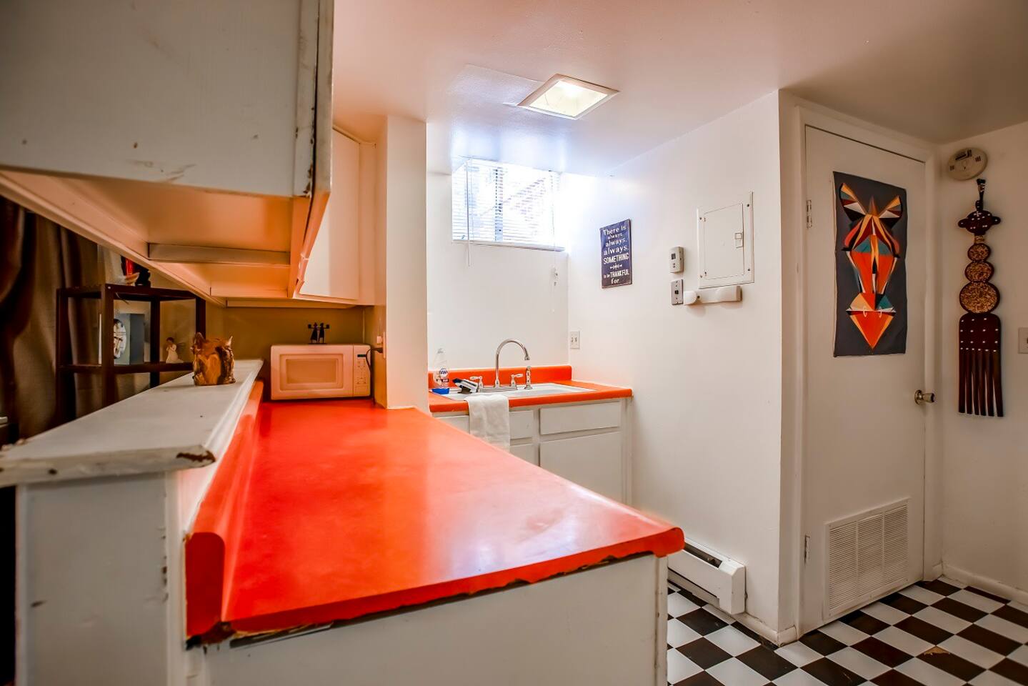 Microwave, Coffee maker, dishwasher (not shown) included in the space.