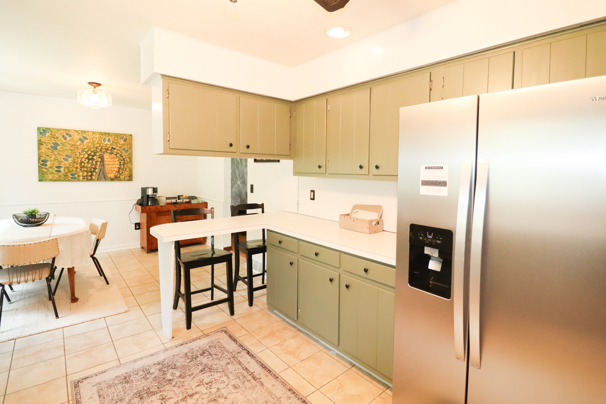 The heart of the home—a fully updated kitchen with all-new appliances, counter seating, and an open flow into the dining area that's perfect for gathering with family and friends.