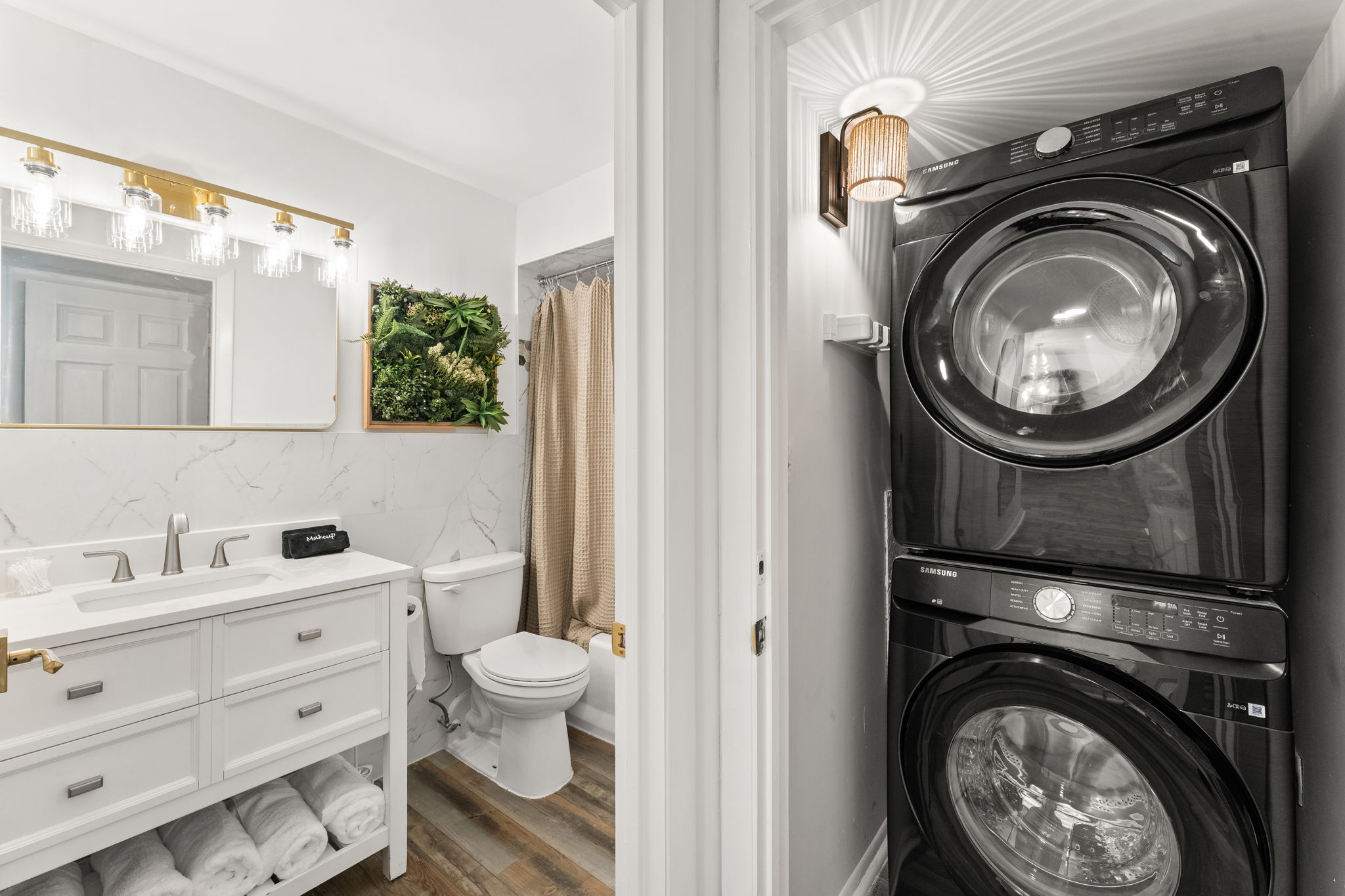 A look across your full sized laundry machines in the main bathroom