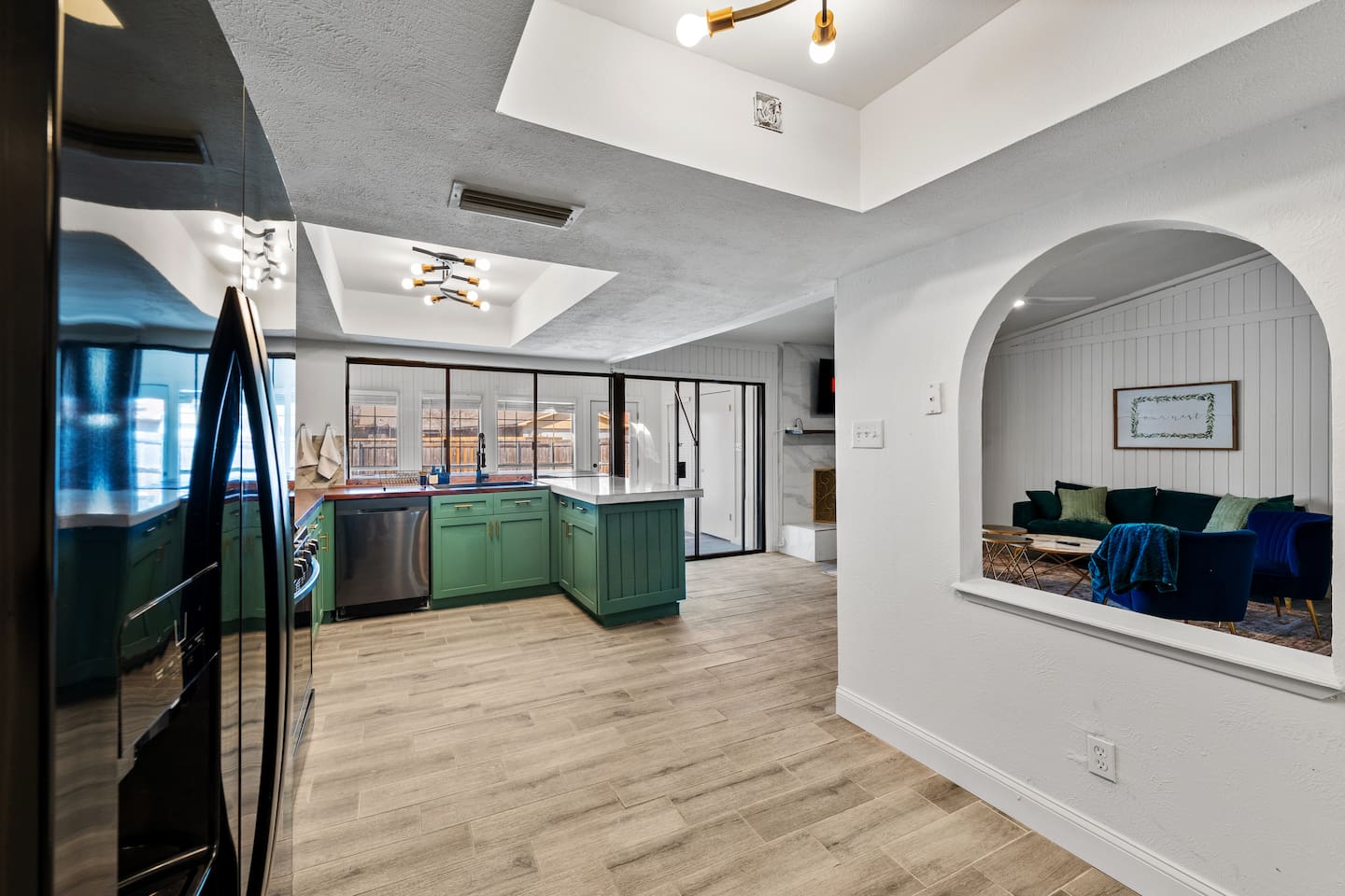 Bright, open kitchen with modern appliances and clean lines—perfect for cooking, entertaining, and staying connected to the group.