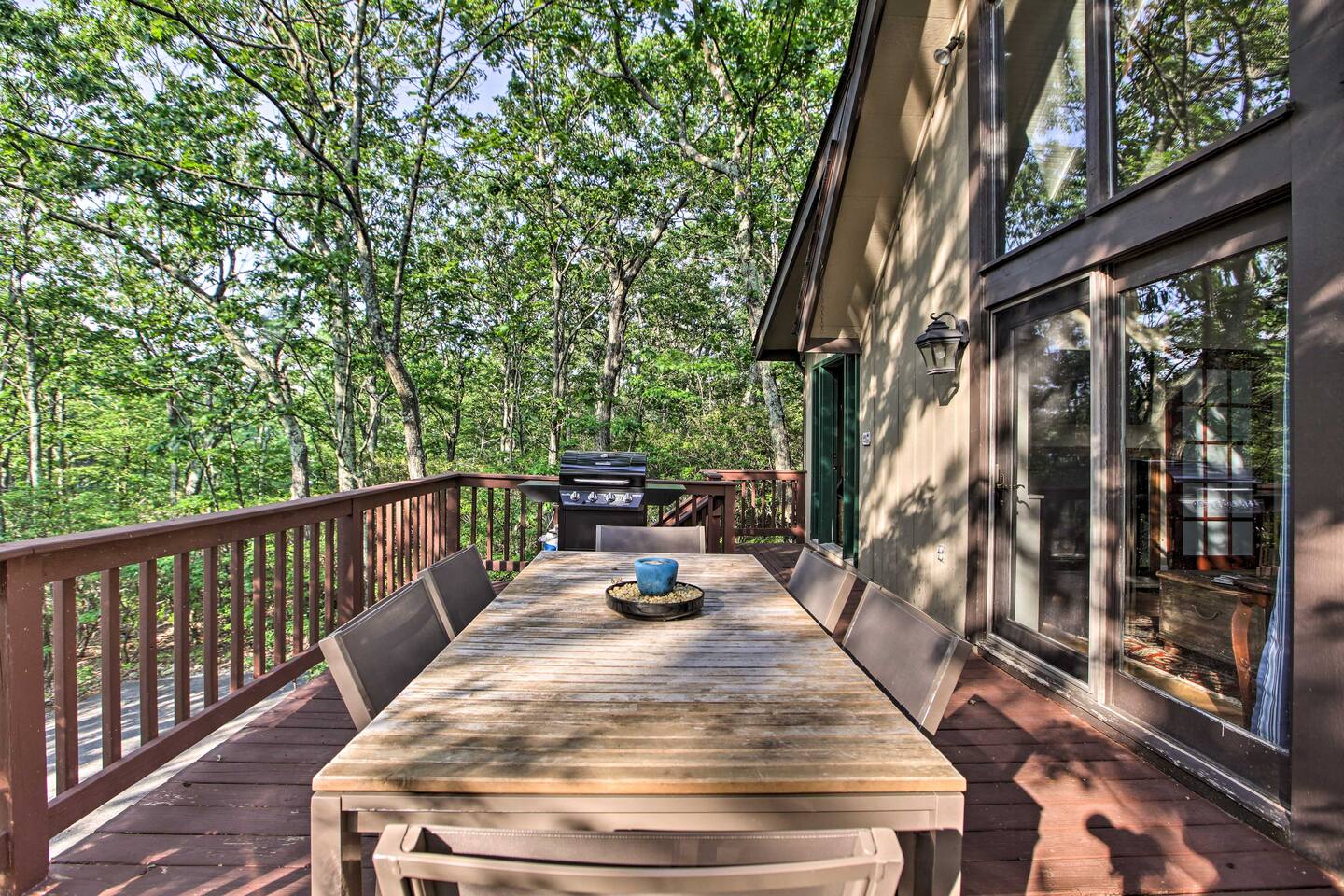 outdoor deck with dining and grill