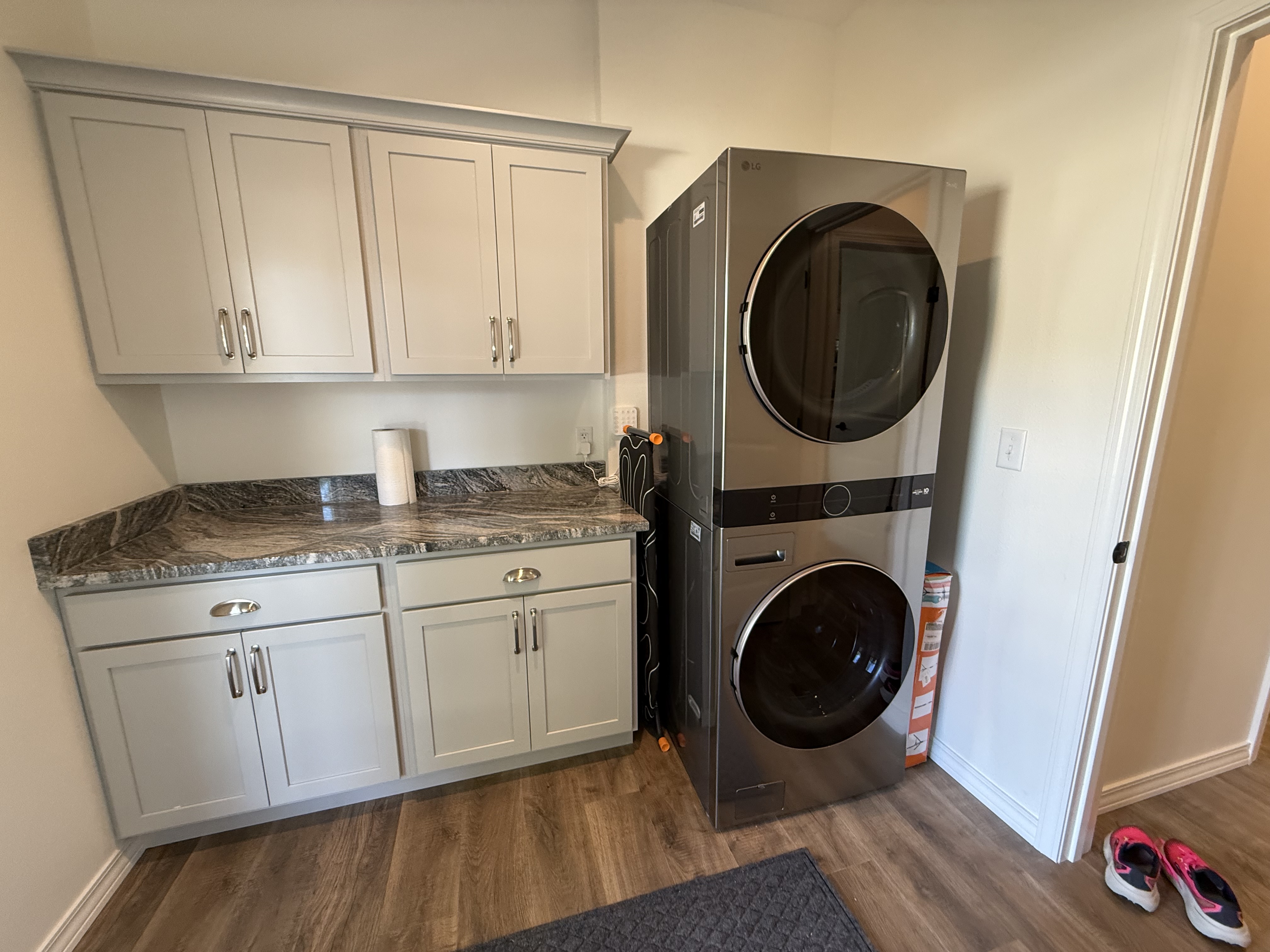 Washer/dryer with more cabinet and countertop space. Iron and iron board provided.