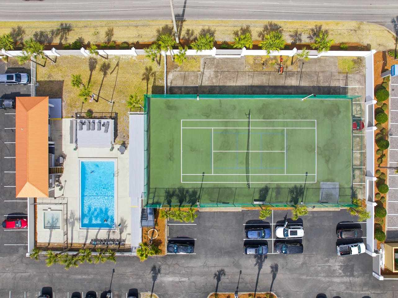 Surf Dweller complex has tennis court, pool and kiddie pool