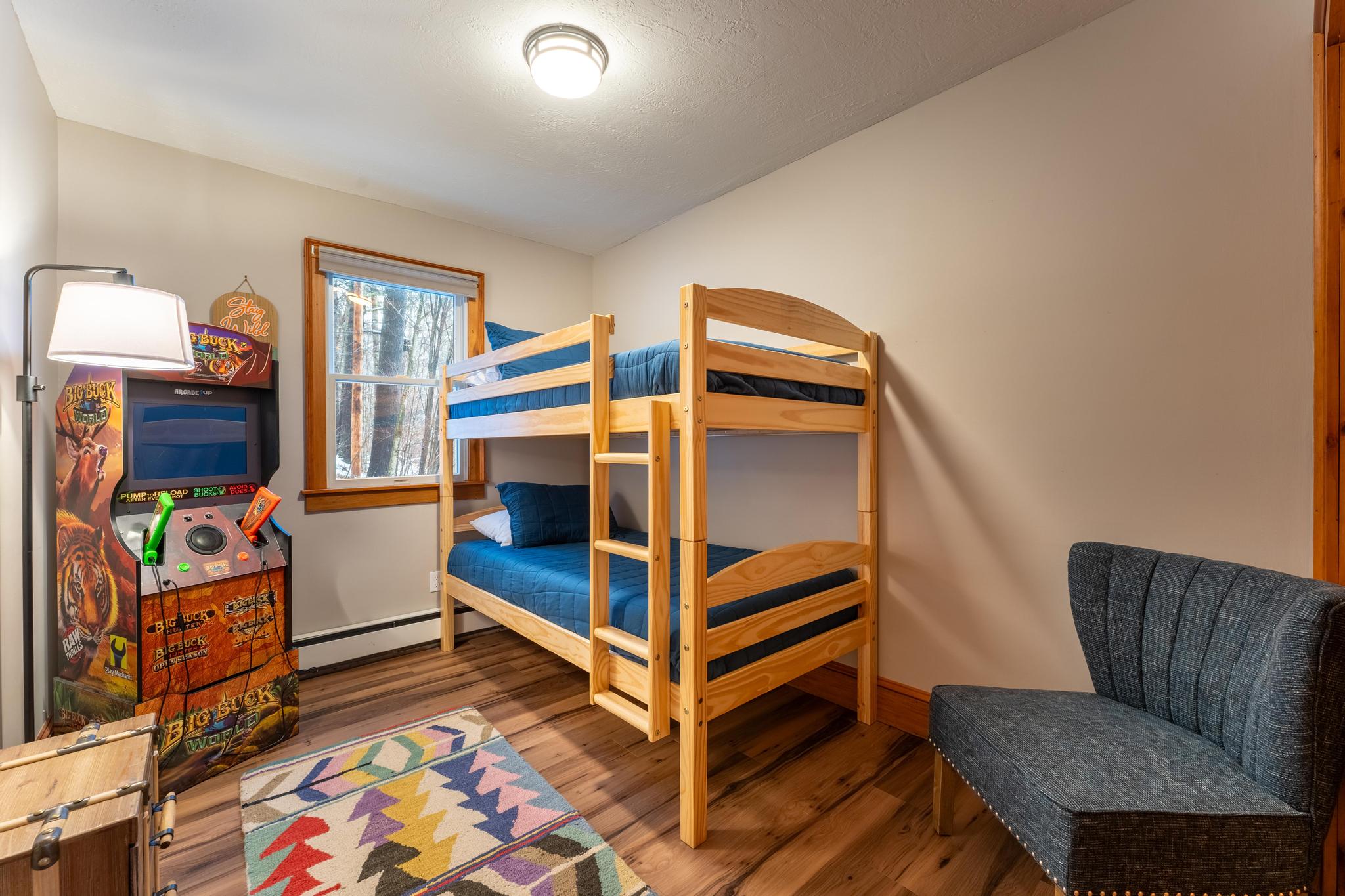 2nd floor bunk room with arcade game