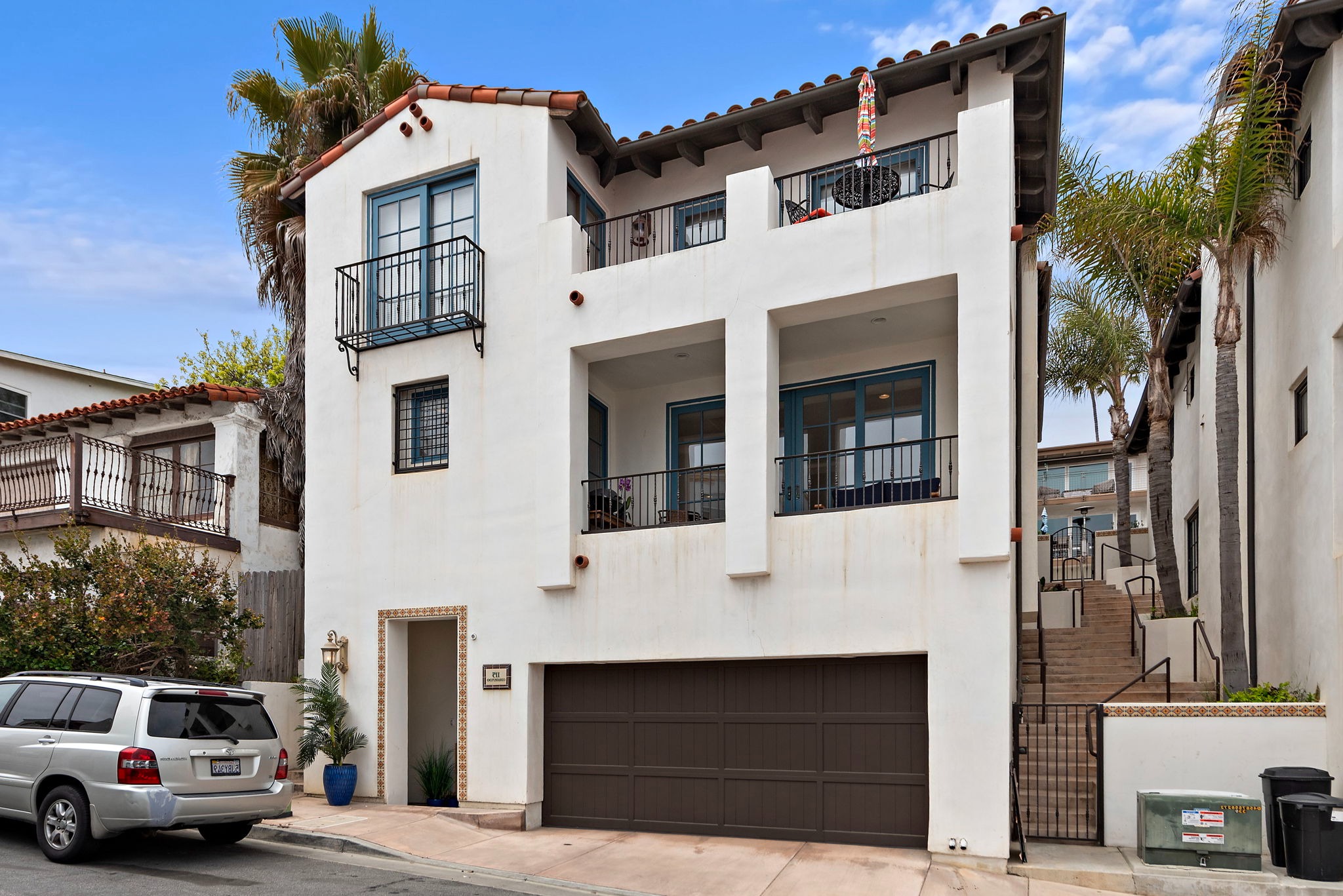 Exterior of the building.  This condo is the lower floor.  Parking for one car inside the garage.  There is also free overnight parking on Coronado Ln if you have a second car.
