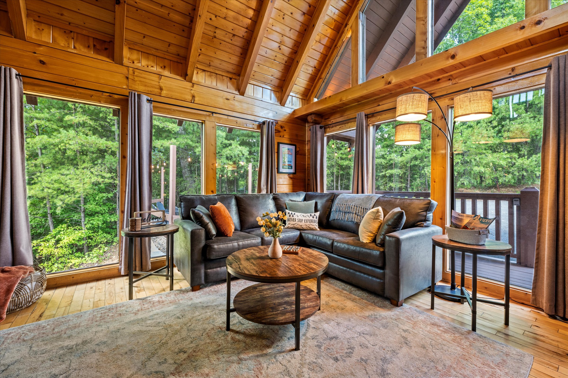 Tree-lined views and big windows make the living room the perfect spot to unwind..