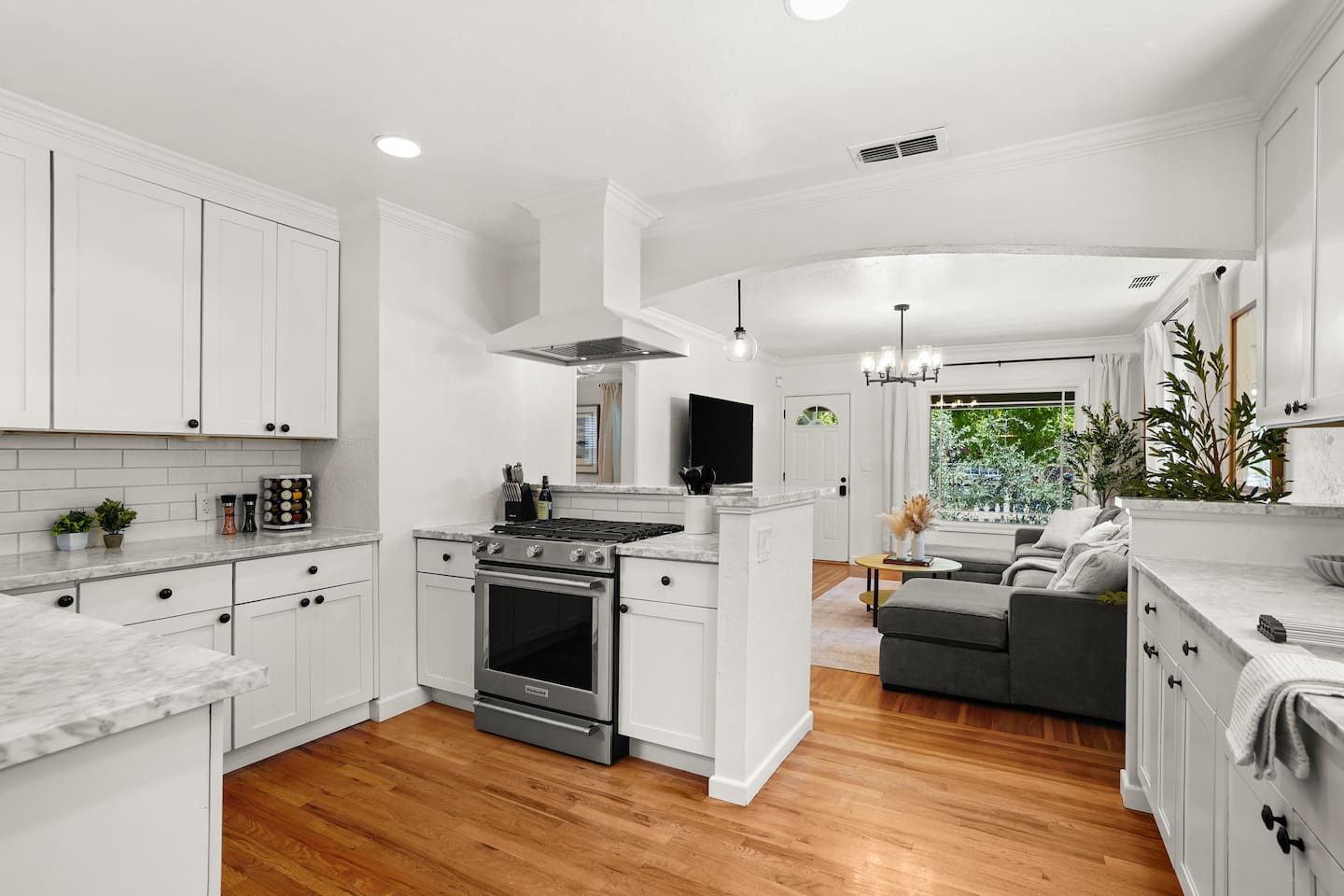 Fully equipped kitchen with modern appliances, stocked coffee bar, ample prep space, and everything needed to cook at home.