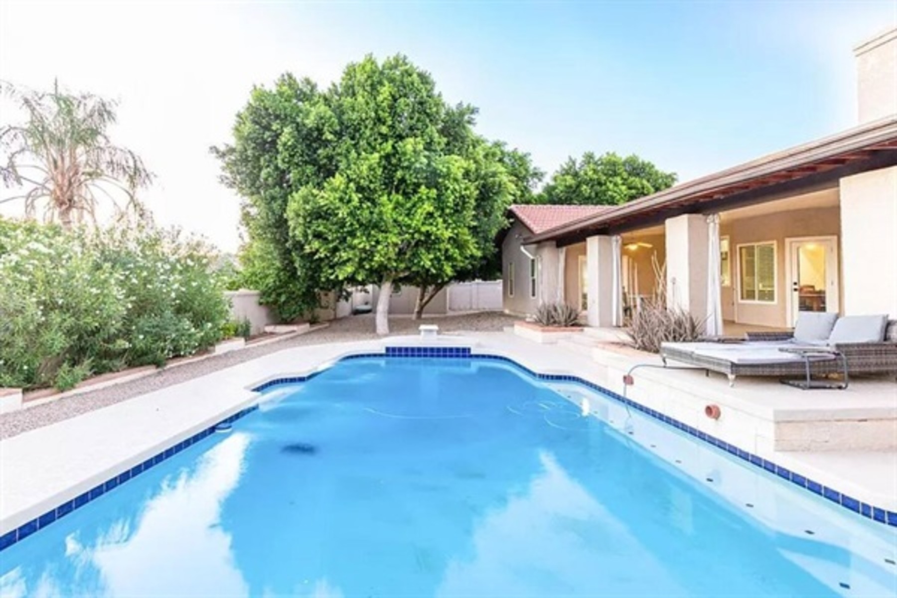 Take a soothing dip in the heated pool surrounded by lush greenery and serene outdoor lounge areas.