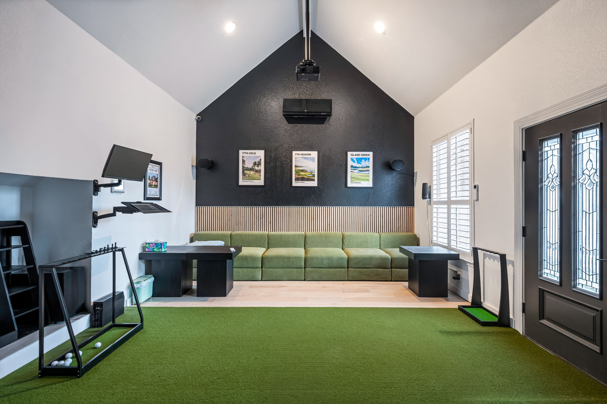Indoor putting green and game space — enjoy year-round fun right inside the home.