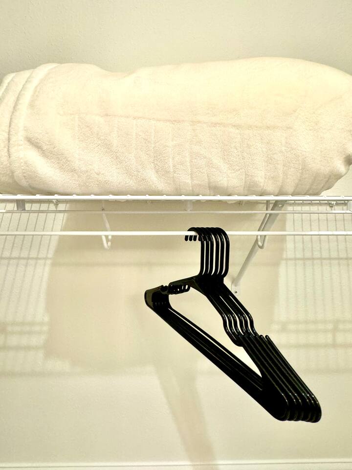 Each bedroom has an extra blanket and hangers 