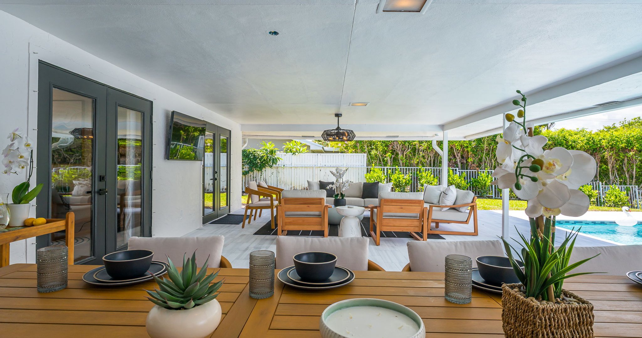 Designed for luxury and comfort, this outdoor space invites you to dine, relax, and unwind in true resort fashion. Enjoy poolside loungers, shaded patio seating, and an ambiance that blends modern elegance with the ease of Florida living