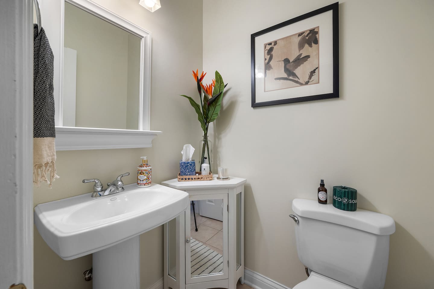 Main floor half bath with shower located in laundry room. 