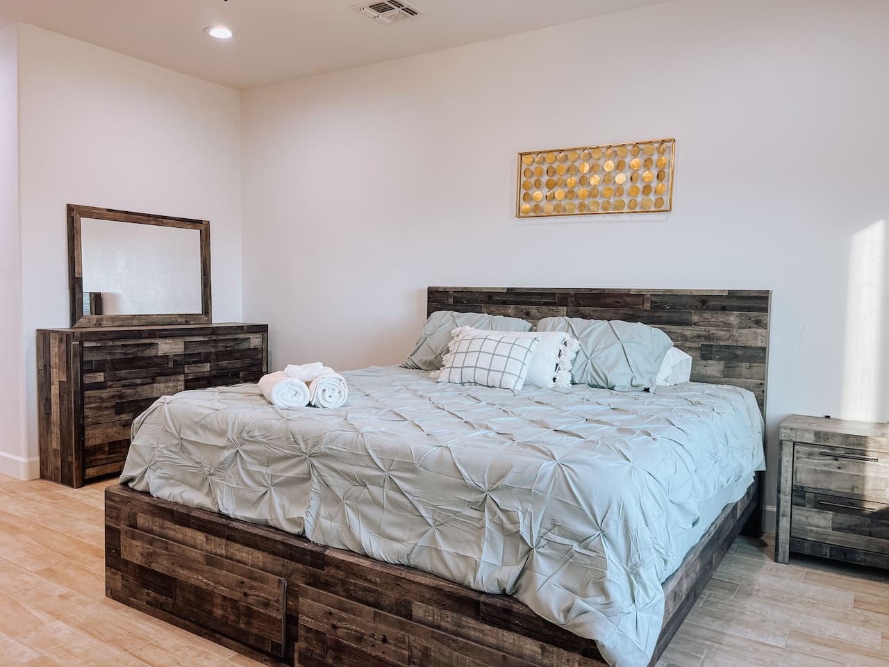 Bright and spacious master bedroom with king size bed 