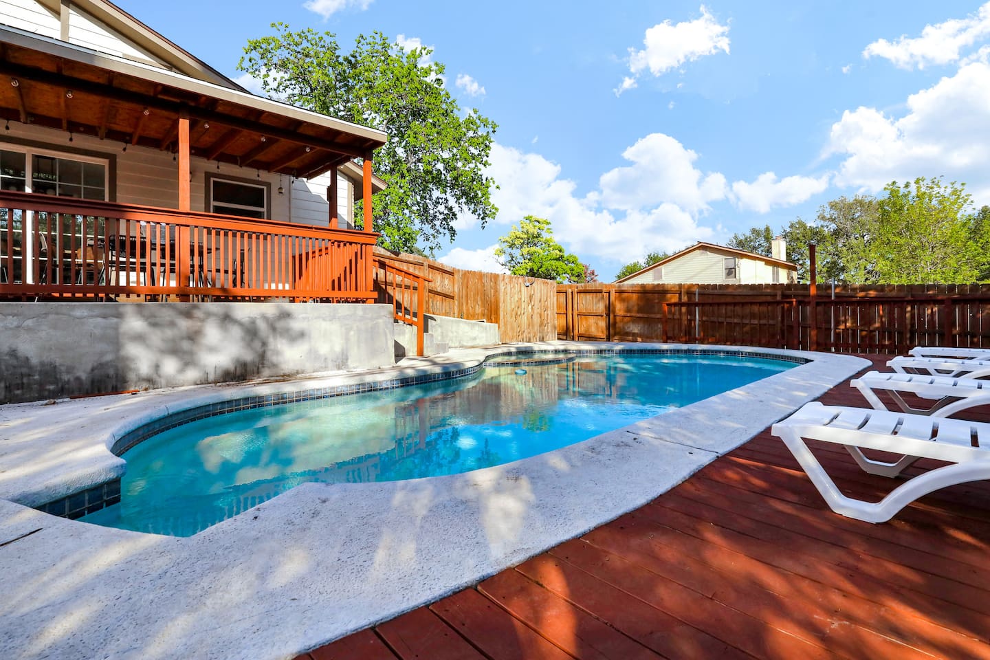 Beautiful pool with hot tub, deck and chaise loungers