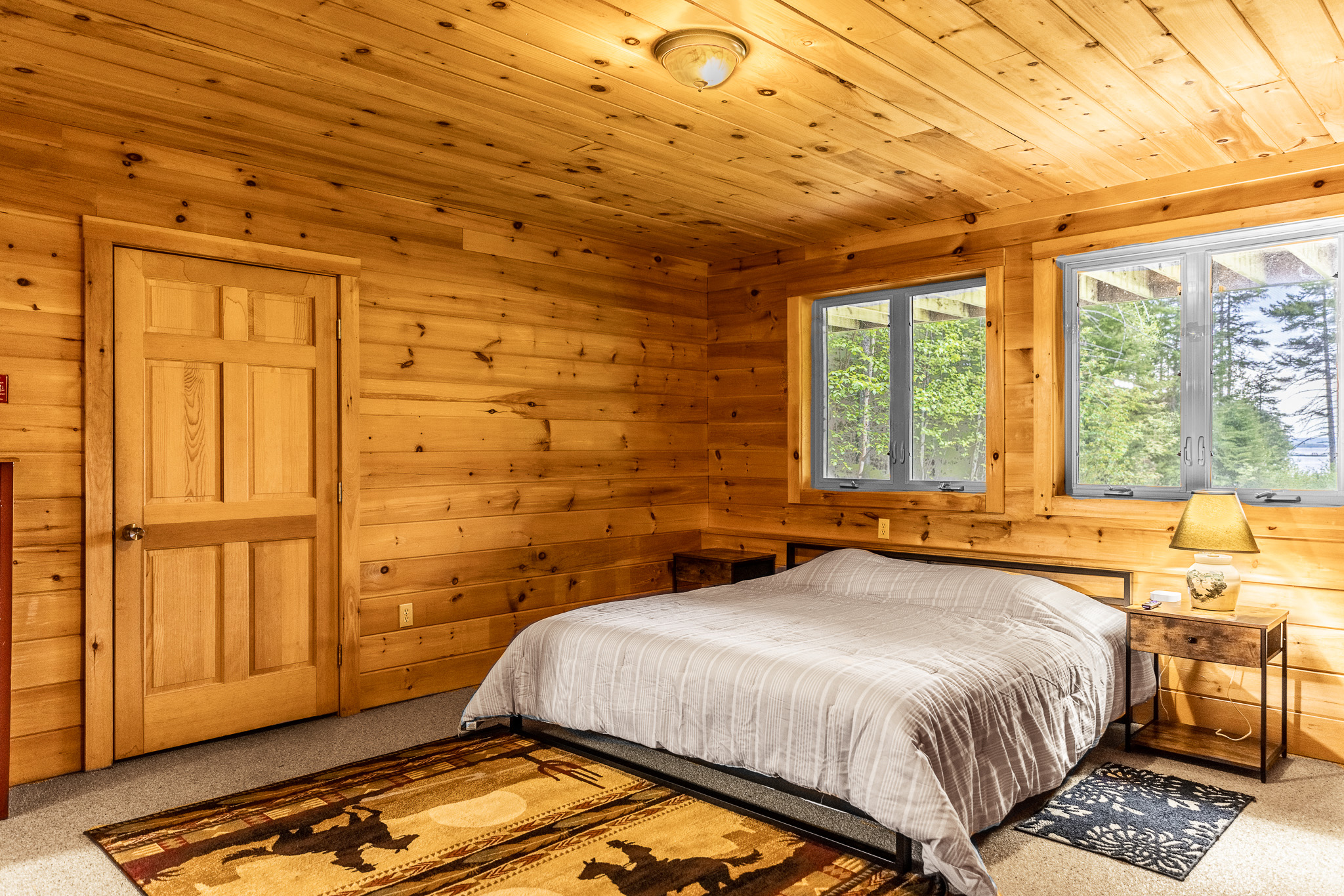 Enjoy the downstairs floor suite. Private and quiet, with views of the beautiful lake, a full attached bathroom, TV for streaming, clothing storage, and charger stations by your king bed.