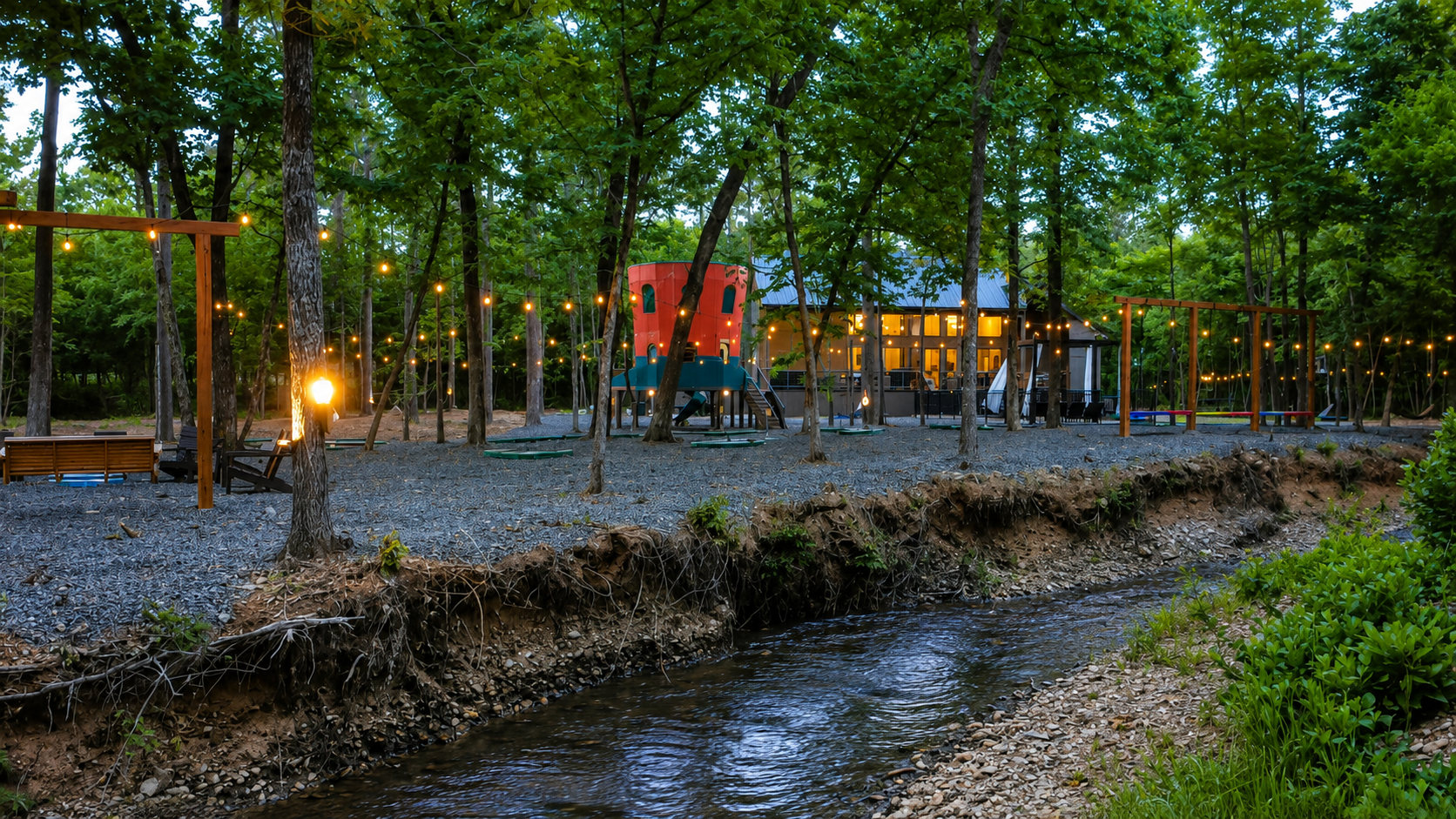 Outdoor Paradise: Sway on swings beneath twinkling lights by the babbling creek! Enjoy nature's charm.
