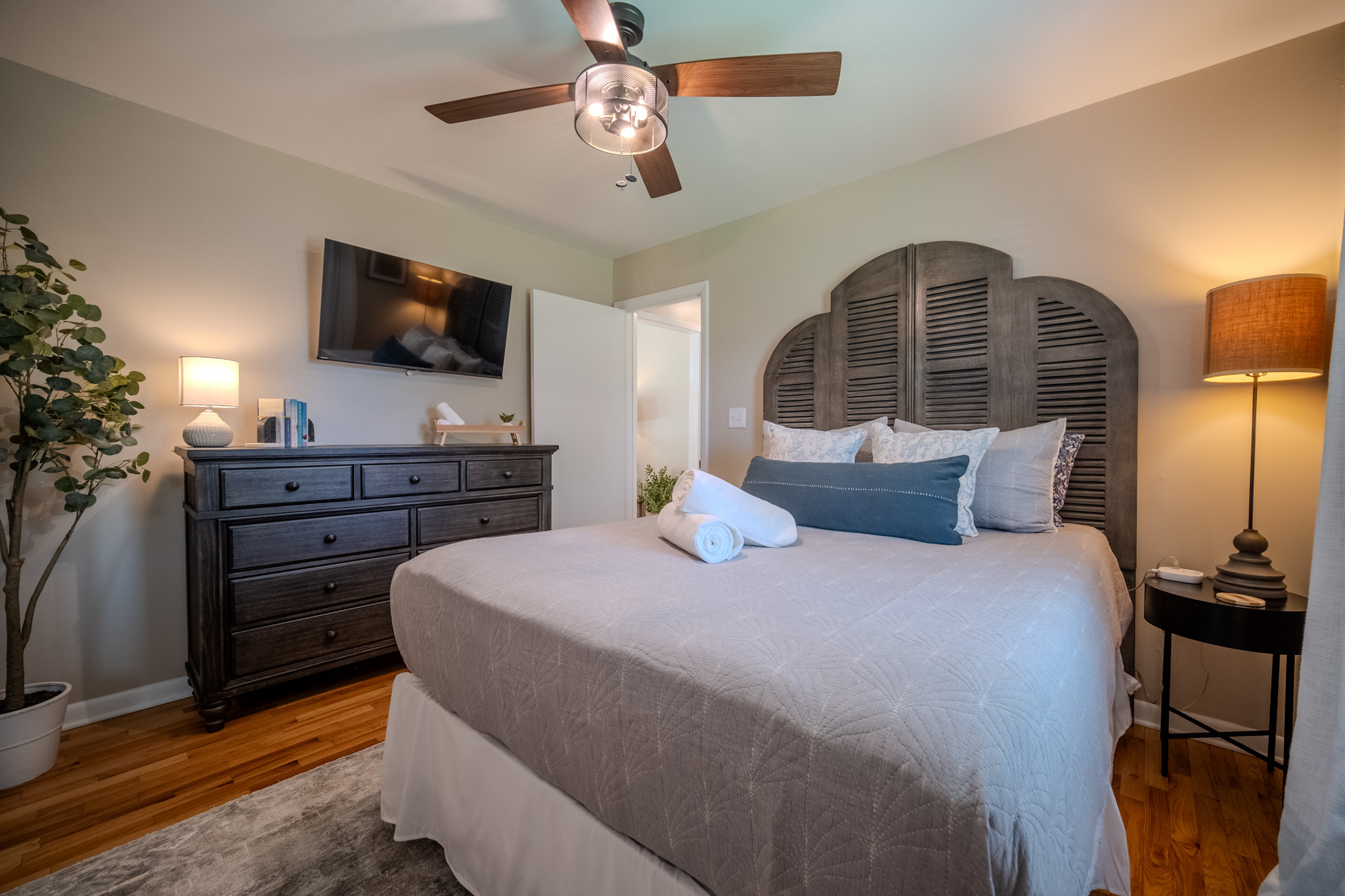 Unwind in this cozy guest room with a queen bed, comfortable linens, smart TV, and plenty of space to relax.