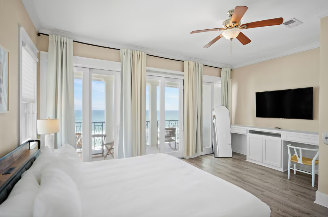 Spacious Master Bedroom (3rd Floor) with King Bed, 55" Smart TV, Gulf Views, Private Balcony, Bathroom with dual vanity, soaker tub & walk-in shower