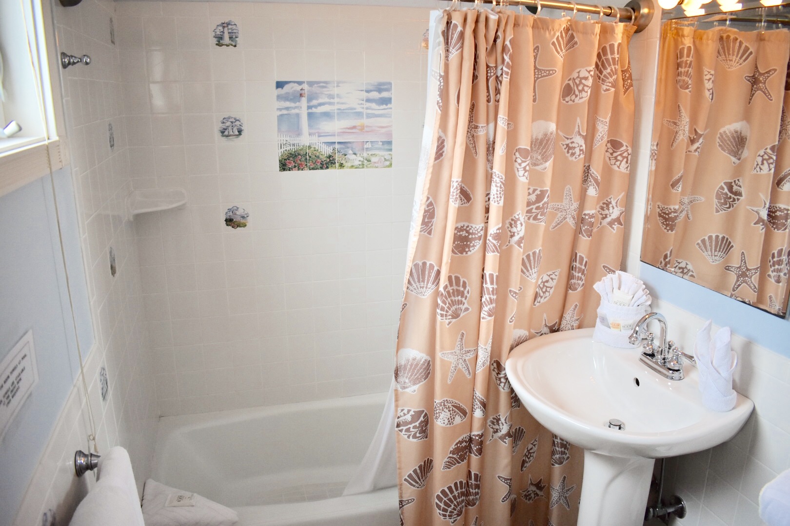 Bathroom has full bath and comes complete with full stock of towels and complimentary soaps and shampoo