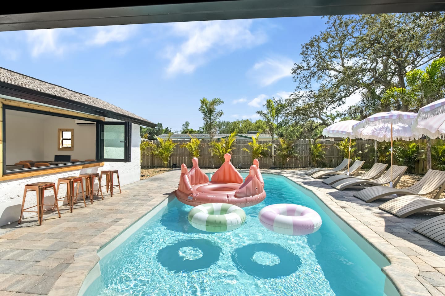 Massive Heated Saltwater Pool with Lush Tropical Landscaping, Games and Pool Cabana Game Room.