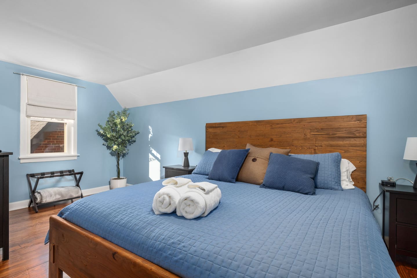 Upstairs bedroom 4 has plush king mattress, 50" flatscreen smart TV, night stands and bedside lamps, charging stations, dresser and closets for storage, and cozy space for baby. Pack-n-play with bassinet and retractable baby gate at top of stairs.