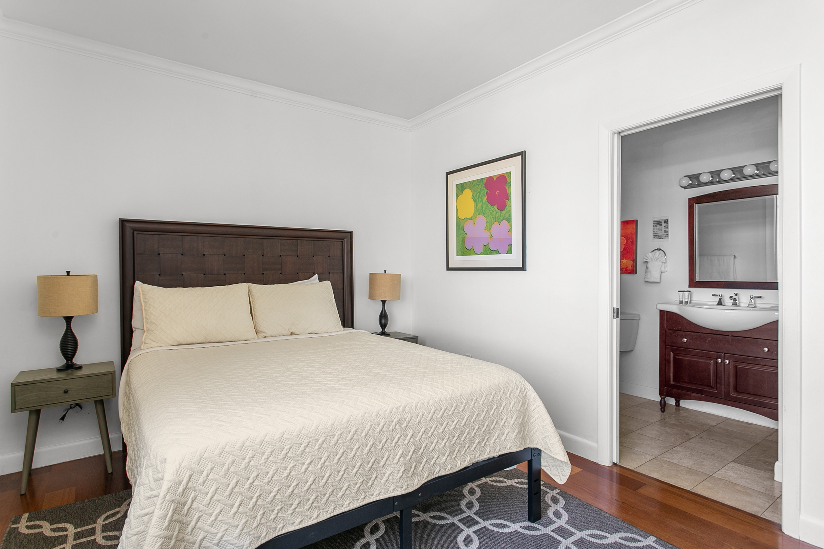 Guest Suite with en-suite bath, closet storage, and room-darkening curtains