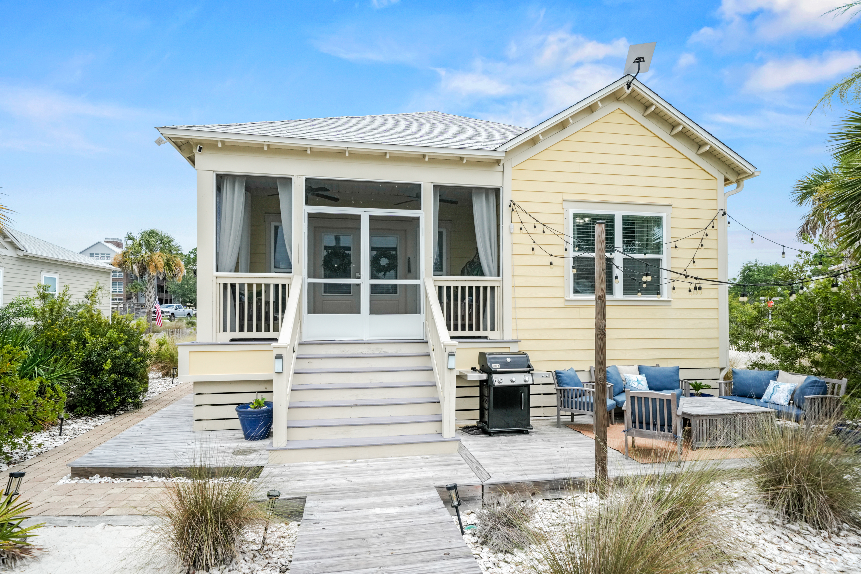 Relax on the welcoming front porch and soak in the peaceful beach neighborhood atmosphere