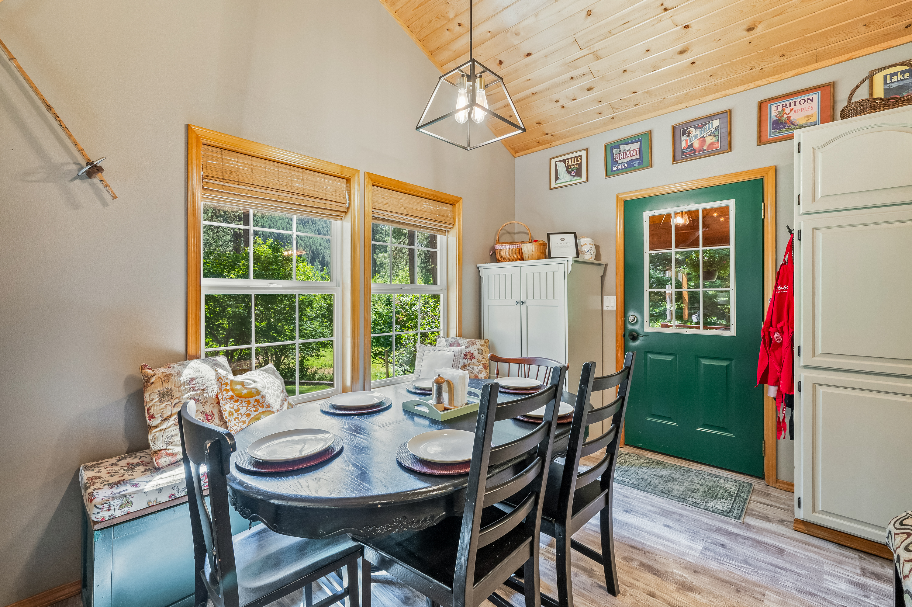 Dining room with window banquet seating and access to the back porch