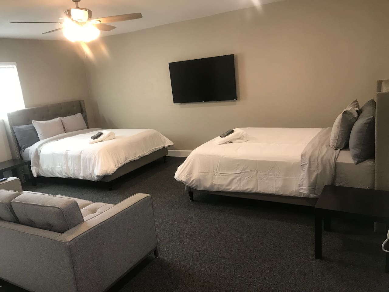 Two queen beds with couch, and a 58inch smart TV in the Bonus Room.