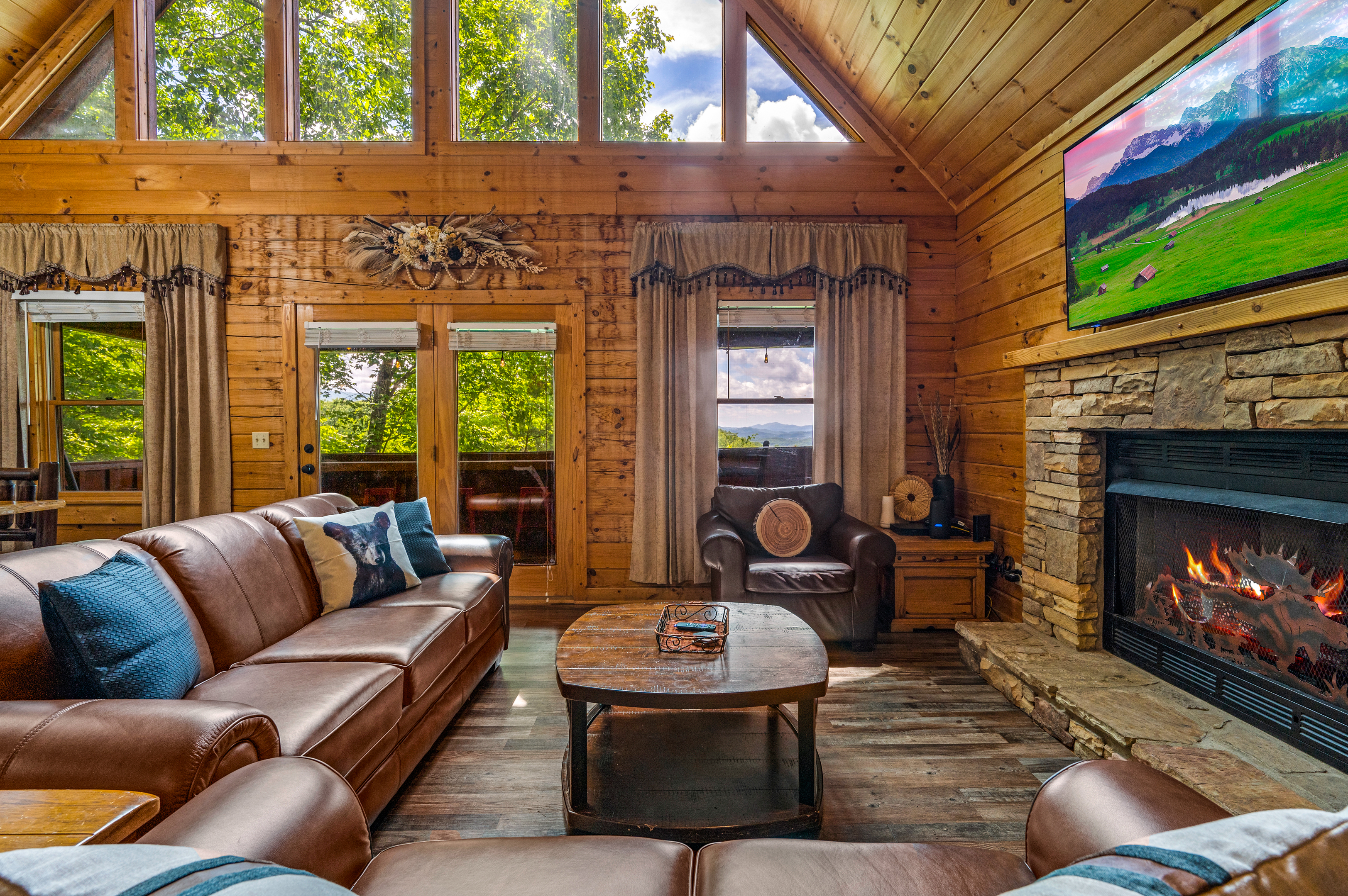 The intimate stone fireplace creates a lovely gathering setting.