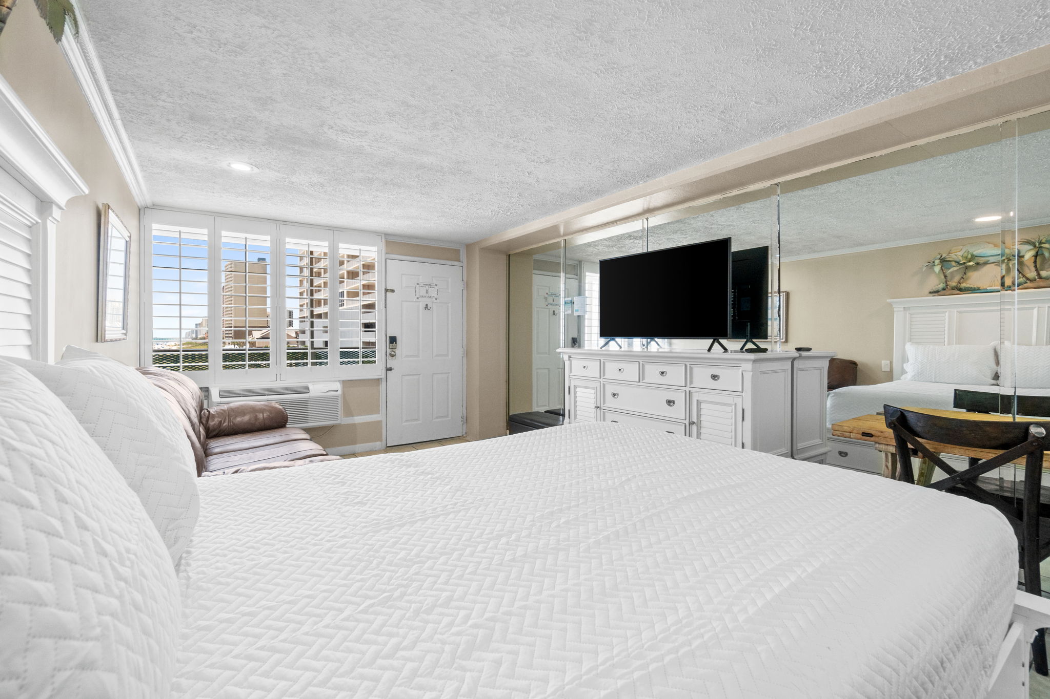 Living Area with Queen Bed and Sleeper Sofa