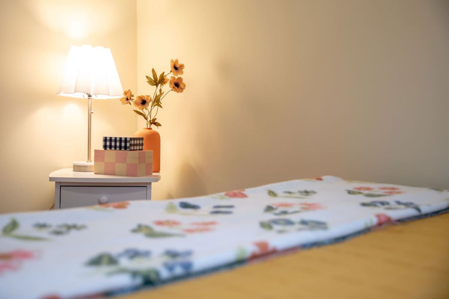 Comfortable queen-sized bedroom offering a restful retreat with ample space and natural light.