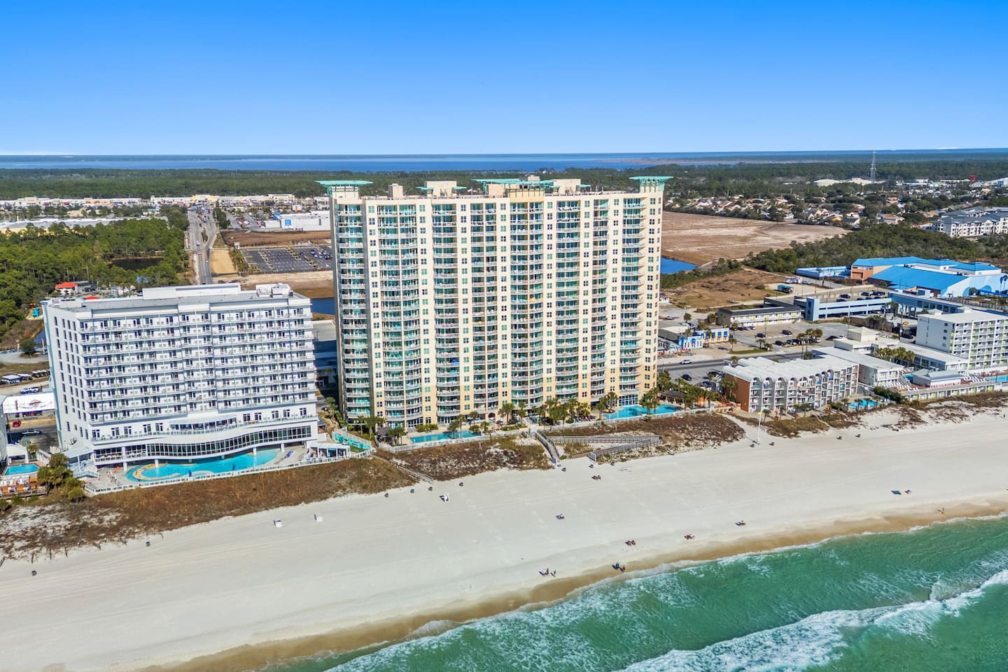 Exterior aerial view of Aqua Resort, an oceanfront resort in Panama City Beach, FL.
